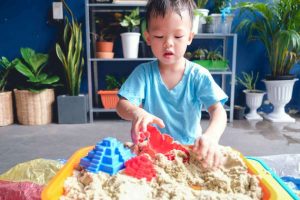 Kid playing with sand