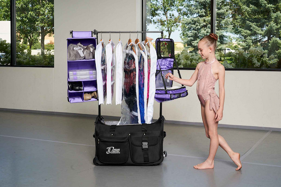 dancer with dance duffel bag and accessories