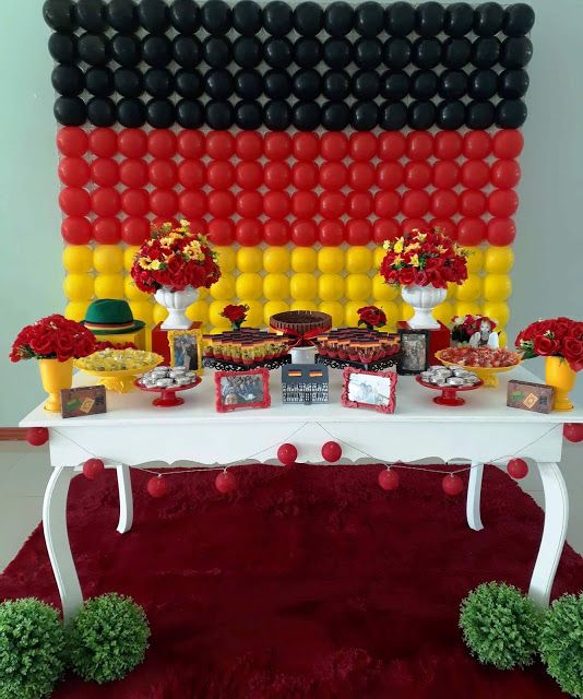 Party with German decoration such as flag made of balloons and table with their food