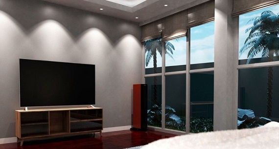 LED downlight fixtures shining over a TV in a living room area