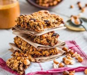 couple protein bars stacked on top of each other placed on a table