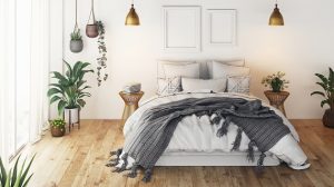 bedroom with an organized bed and a lot of plants