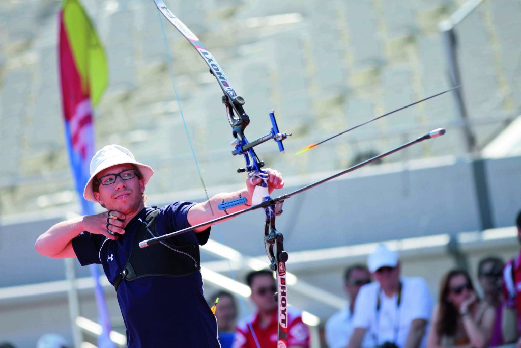 man in the bow international competition with Target Recurve Bow