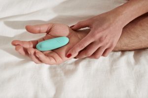 man and woman holding bullet vibrator