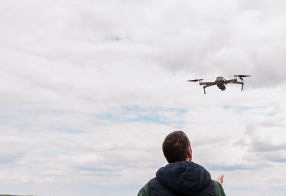 A person using a drone outdoors