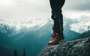 Hiking-boots-with-mountains-in-background
