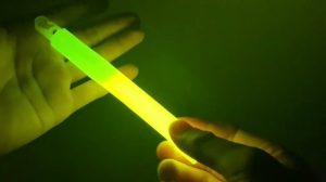 person holding a chemlight