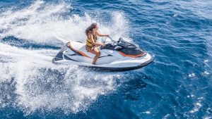 girl on a jet ski with safety vest